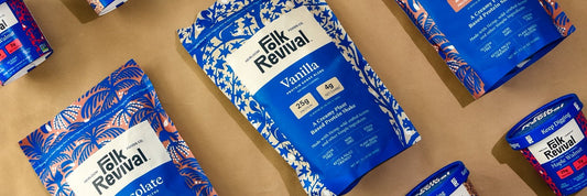 Folk Revival hot cereal cups and pouches laid out on brown kraft paper, seen from above.